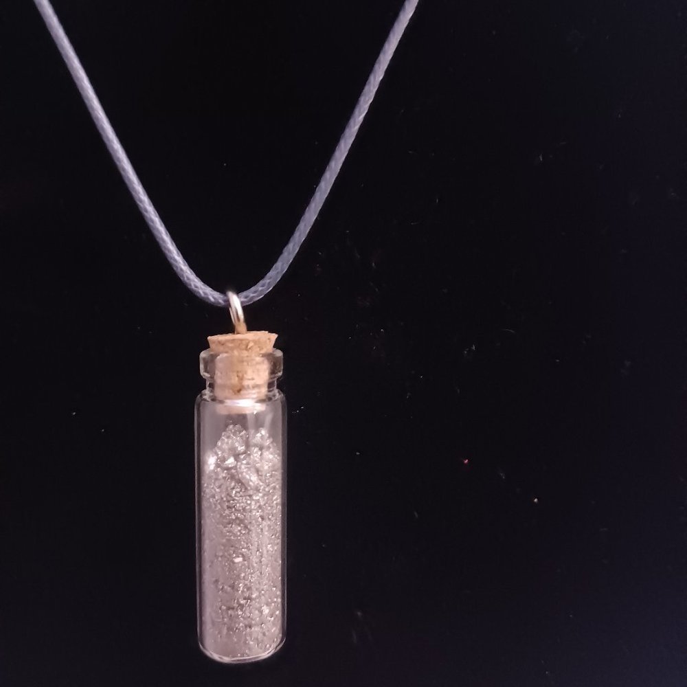 Wax necklace with high carbonated silicon filled bottle pendant